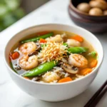 Tasty-style recipe card for Sizzling Rice Soup with crispy rice, shrimp, and vegetables