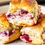 Havarti Cranberry Turkey Sliders with melted cheese and cranberry sauce